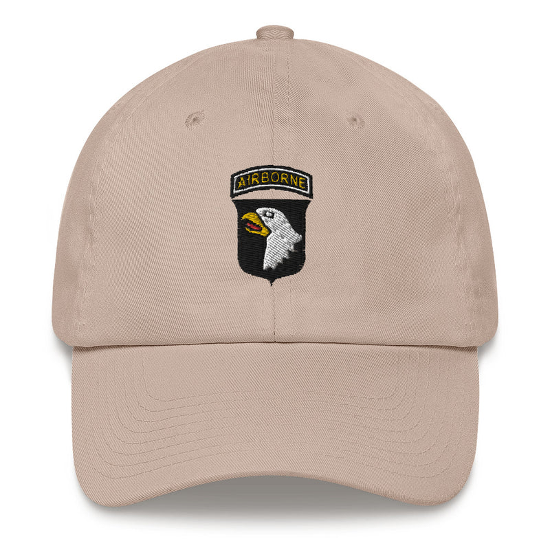 A stone colored 101st Airborne Hat with the logo on the front.  The hat has a curved visor and an adjustable strap at the back.