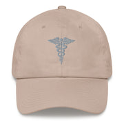 A stone colored Hospital Corpsman Hat with the logo on the front.  The hat has a curved visor and an adjustable strap at the back.