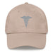 A stone colored Hospital Corpsman Hat with the logo on the front.  The hat has a curved visor and an adjustable strap at the back.