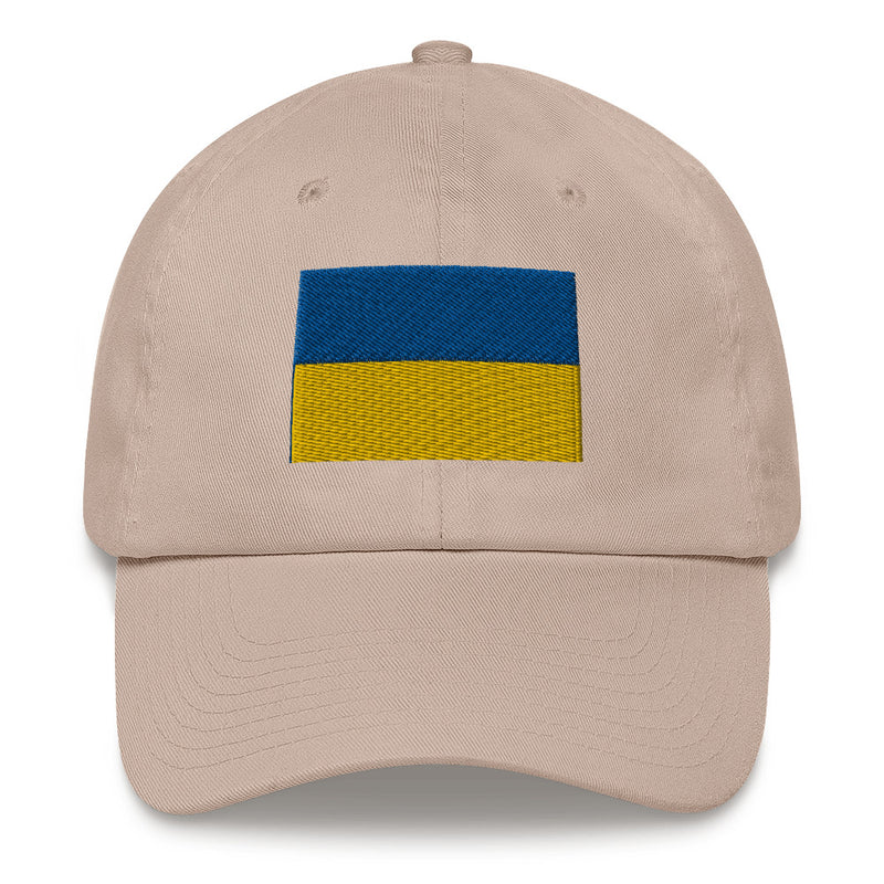 A stone colored Ukrainian Flag Hat with the logo on the front.  The hat has a curved visor and an adjustable strap at the back.