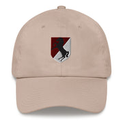 A stone colored 11th Armored Cavalry Regiment Hat with the logo on the front.  The hat has a curved visor and an adjustable strap at the back.