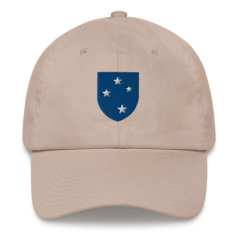 A stone colored 23rd Infantry Division Hat with the logo on the front.  The hat has a curved visor and an adjustable strap at the back.