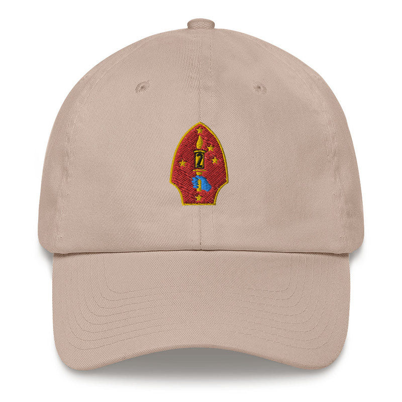 A stone colored 2nd Marine Division Hat with the logo on the front.  The hat has a curved visor and an adjustable strap at the back.