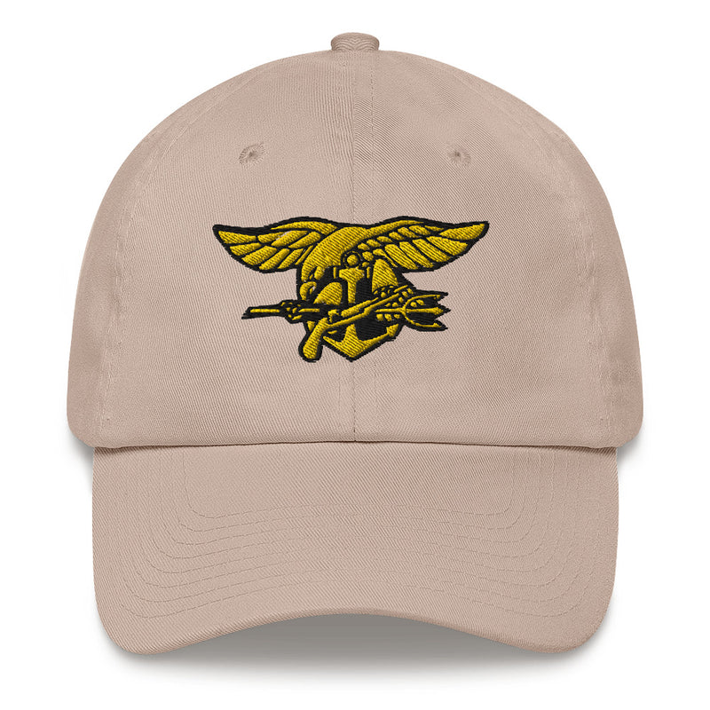 A stone colored Navy Seals Hat with the logo on the front.  The hat has a curved visor and an adjustable strap at the back.