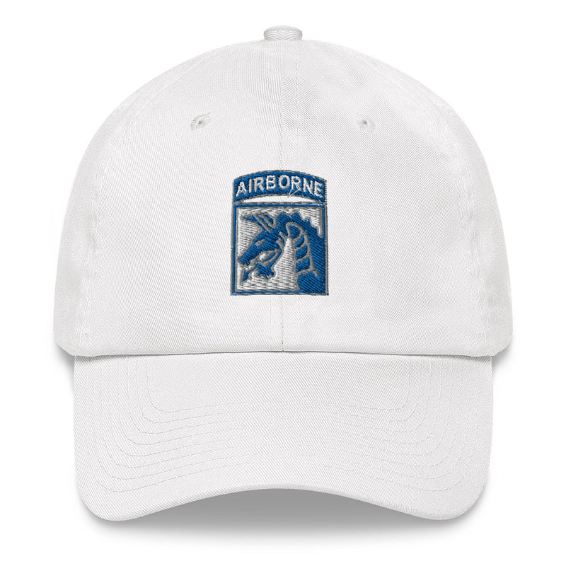 A white XVIII Airborne Corps Hat with the logo on the front.  The hat has a curved visor and an adjustable strap at the back.