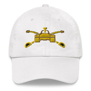 A white Army Armor Hat with the logo on the front.  The hat has a curved visor and an adjustable strap at the back.