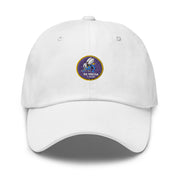 A white Navy Seabees Hat with the logo on the front.  The hat has a curved visor and an adjustable strap at the back.