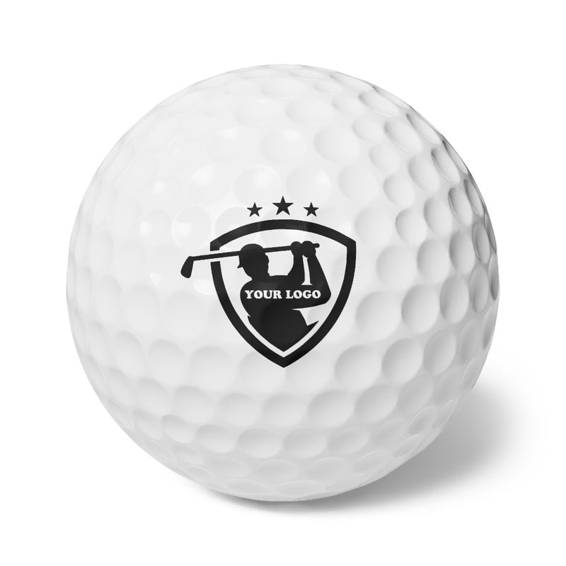 A personalized set of golf balls (6 pack) in white, each with a black golfer silhouette swinging inside a shield, three stars above, and "Your Logo" text—ideal for custom or gift golf balls.