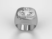 A video illustrating a sleek silver men's military style signet ring with a raised Master Parachutist Badge logo rotating on a 360 degree turn table.