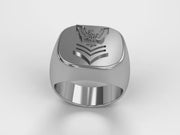 A video illustrating a sleek silver men's military style signet ring with a raised 1st Class Chevron Badge logo rotating on a 360 degree turn table.
