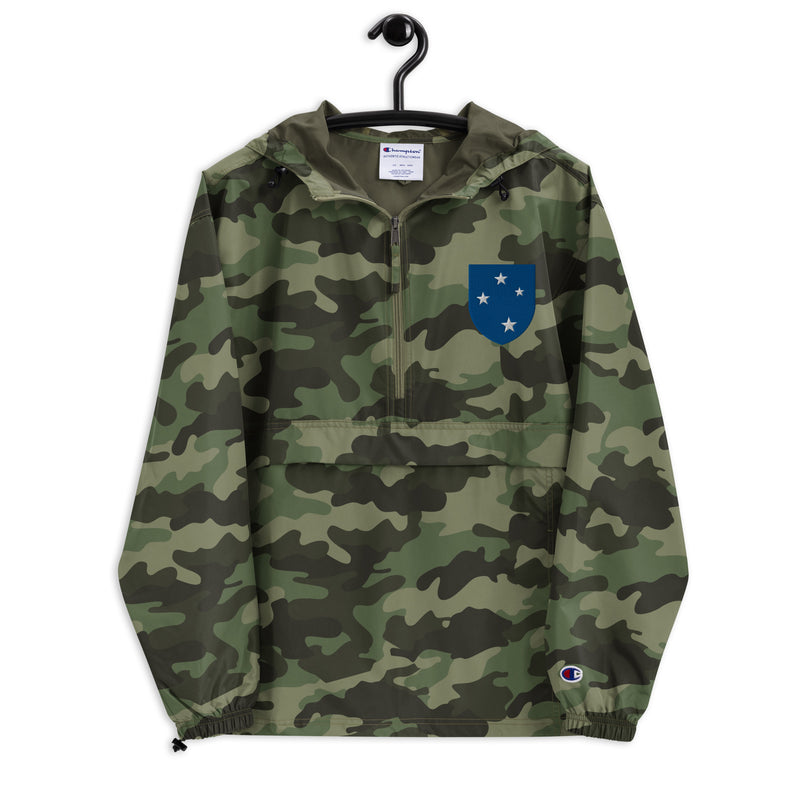 23rd Infantry Division Green Camouflage Champion packable jacket with a detailed embroidered logo