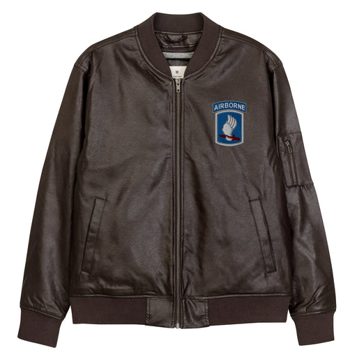 The 173rd Airborne Brigade Embroidered Brown Leather Bomber Jacket featuring a front zipper, front pockets, and a small zippered pocket on the left sleeve.