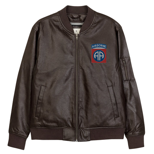 The 82nd Airborne Embroidered Brown Leather Bomber Jacket featuring a front zipper, front pockets, and a small zippered pocket on the left sleeve.