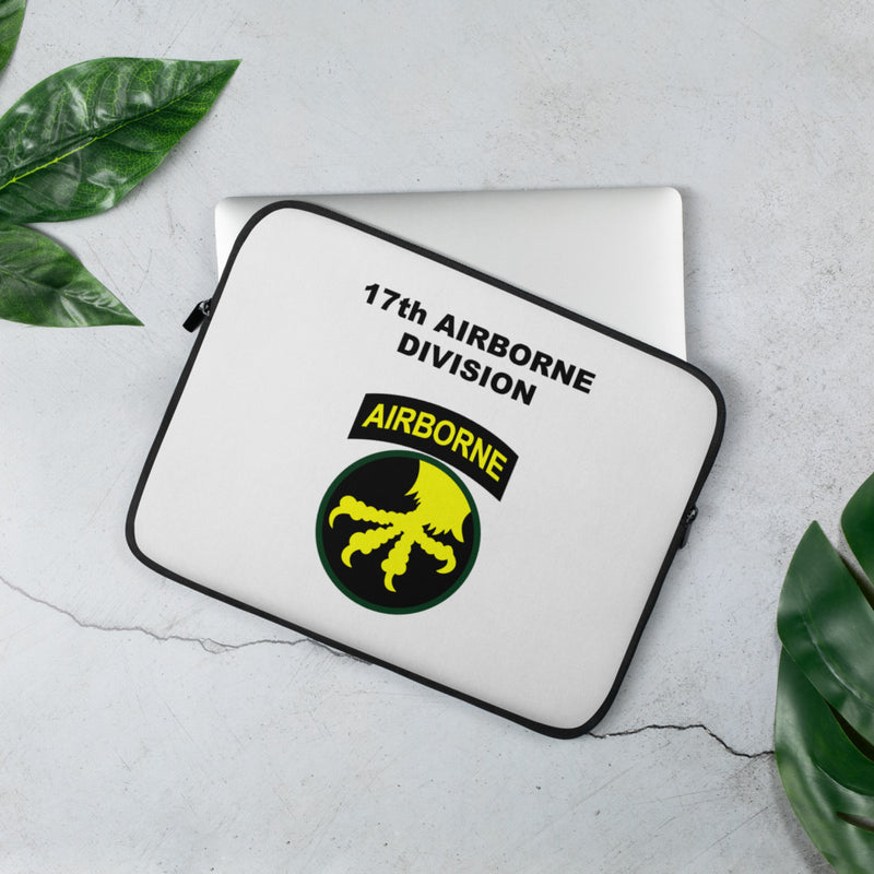 A lightweight and water-resistant white Laptop Sleeve with the 101st Airborne Division logo printed on top. The laptop sleeve is designed to fit a 13" laptop.