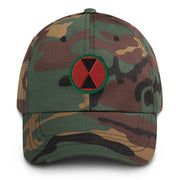 A military style 7th Infantry Division Hat with camouflage and the logo on the front.  The hat has a curved visor and an adjustable strap at the back. 