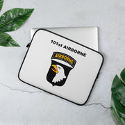 A lightweight and water-resistant white Laptop Sleeve with the 101st Airborne Division logo printed on top. The laptop sleeve is designed to fit a 13" laptop.