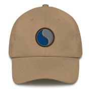A khaki colored 29th Infantry Division Hat with the logo on the front.  The hat has a curved visor and an adjustable strap at the back.