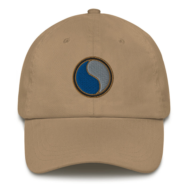 A khaki colored 29th Infantry Division Hat with the logo on the front.  The hat has a curved visor and an adjustable strap at the back.