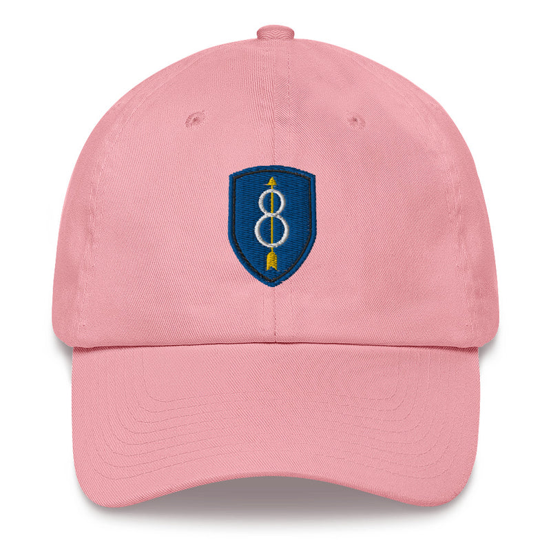 A pink 8th Infantry Division Hat with the logo on the front.  The hat has a curved visor and an adjustable strap at the back.