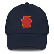 A navy blue 28th Infantry Division Hat with the logo on the front.  The hat has a curved visor and an adjustable strap at the back.