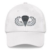 A white Basic Parachutist Hat with the logo on the front.  The hat has a curved visor and an adjustable strap at the back.