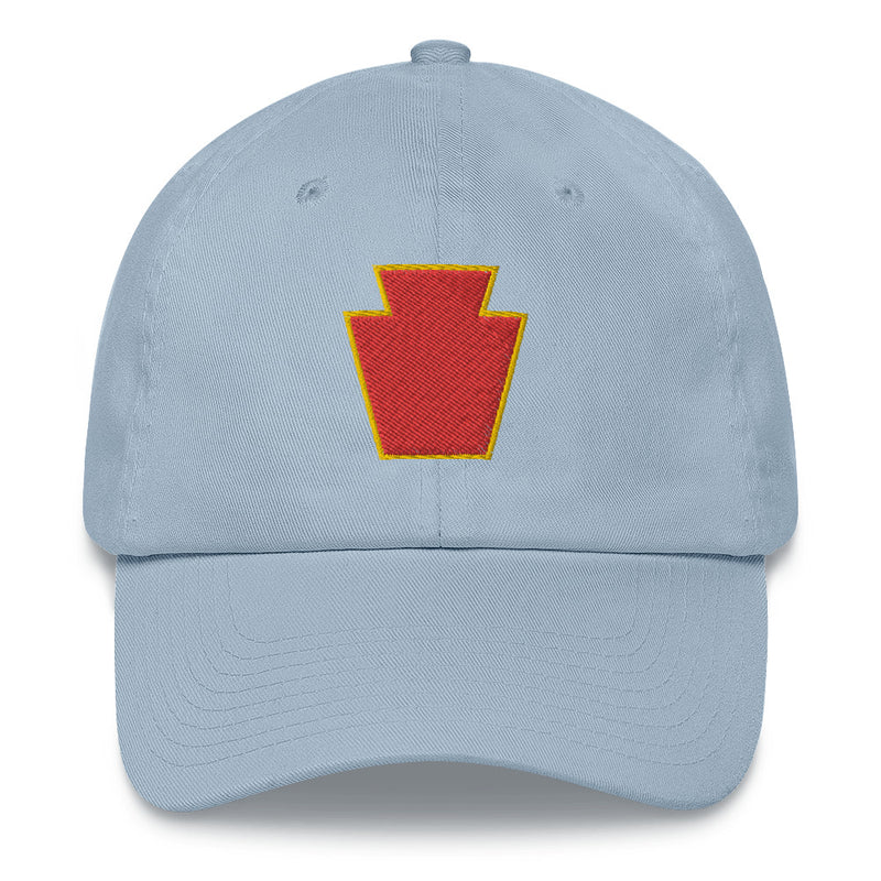 A light blue 28th Infantry Division Hat with the logo on the front.  The hat has a curved visor and an adjustable strap at the back.