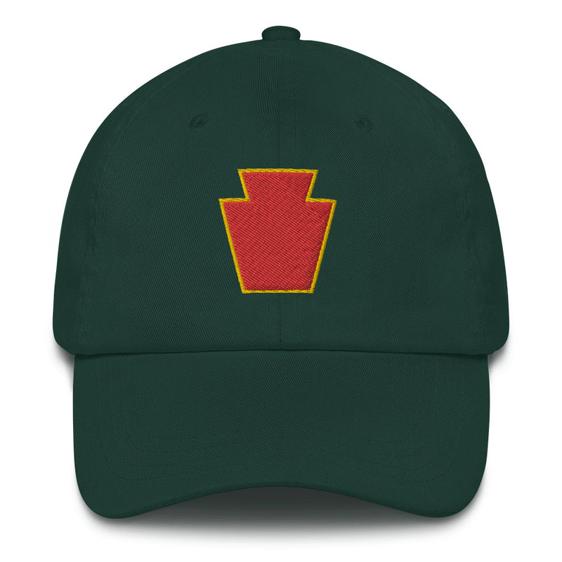 A spruce colored 28th Infantry Division Hat with the logo on the front.  The hat has a curved visor and an adjustable strap at the back.