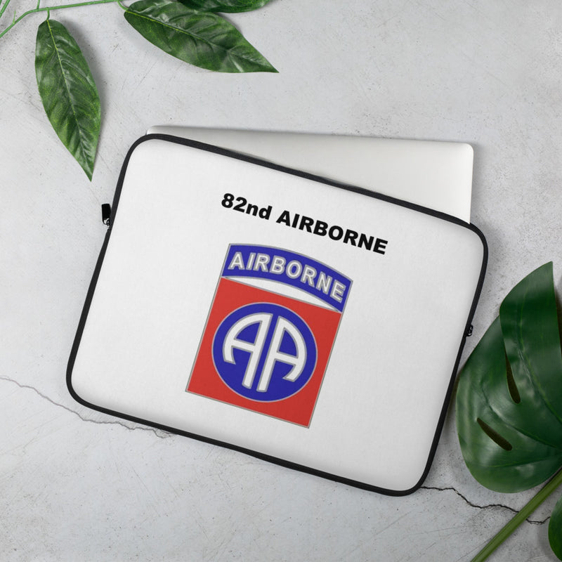 A lightweight and water-resistant white Laptop Sleeve with the 82nd Airborne logo printed on top. The laptop sleeve is designed to fit a 15" laptop.
