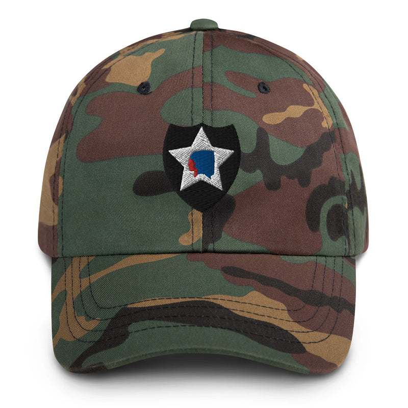 A military style 2nd Infantry Division Hat with camouflage and the logo on the front.  The hat has a curved visor and an adjustable strap at the back. 