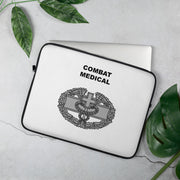 A lightweight and water-resistant white Laptop Sleeve with the Combat Medical logo printed on top. The laptop sleeve is designed to fit a 15" laptop.