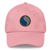 A pink 29th Infantry Division Hat with the logo on the front.  The hat has a curved visor and an adjustable strap at the back.