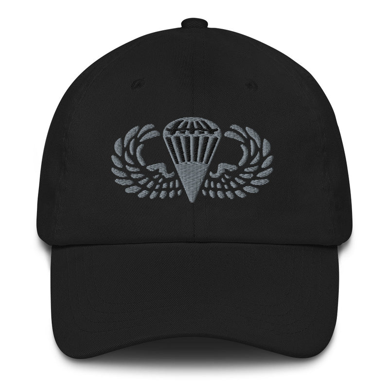 A black Basic Parachutist Hat with the logo on the front.  The hat has a curved visor and an adjustable strap at the back.