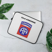 A lightweight and water-resistant white Laptop Sleeve with the 82nd Airborne logo printed on top. The laptop sleeve is designed to fit a 13" laptop.