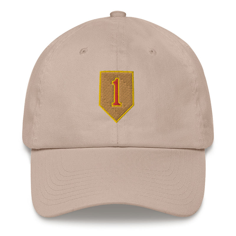 A stone colored 1st Infantry Division Hat with the logo on the front.  The hat has a curved visor and an adjustable strap at the back.