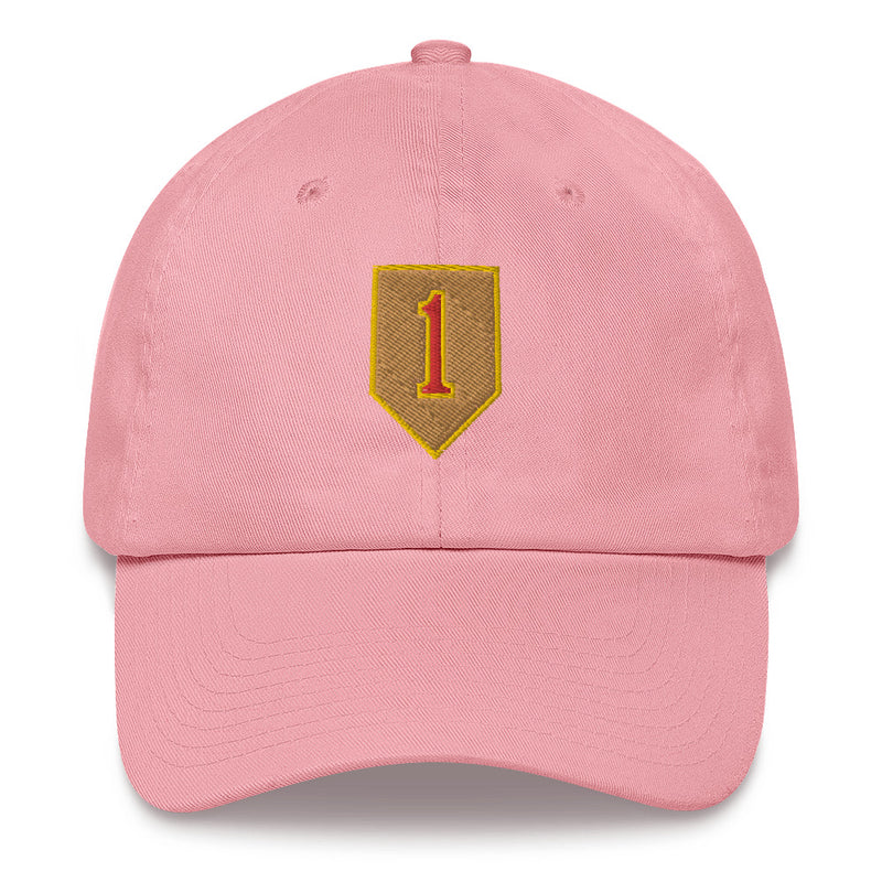 A pink 1st Infantry Division Hat with the logo on the front.  The hat has a curved visor and an adjustable strap at the back.