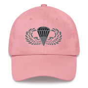 A pink Basic Parachutist Hat with the logo on the front.  The hat has a curved visor and an adjustable strap at the back.