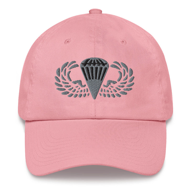 A pink Basic Parachutist Hat with the logo on the front.  The hat has a curved visor and an adjustable strap at the back.
