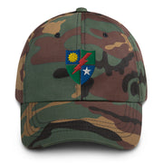 A military style 75th Ranger Regiment Hat with camouflage and the logo on the front.  The hat has a curved visor and an adjustable strap at the back. 