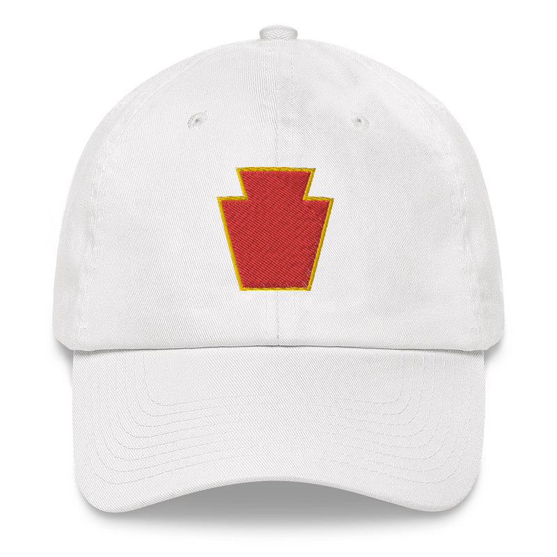 A white 28th Infantry Division Hat with the logo on the front.  The hat has a curved visor and an adjustable strap at the back.