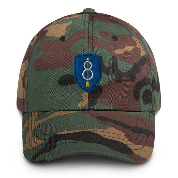 A military style 8th Infantry Division Hat with camouflage and the logo on the front.  The hat has a curved visor and an adjustable strap at the back. 