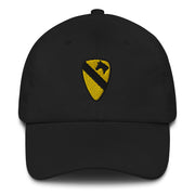 A black 1st Cavalry Division Hat with the logo on the front.  The hat has a curved visor and an adjustable strap at the back.