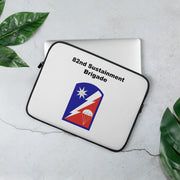 A lightweight and water-resistant white Laptop Sleeve with the 82nd Sustainment Brigade logo printed on top. The laptop sleeve is designed to fit a 13" laptop.