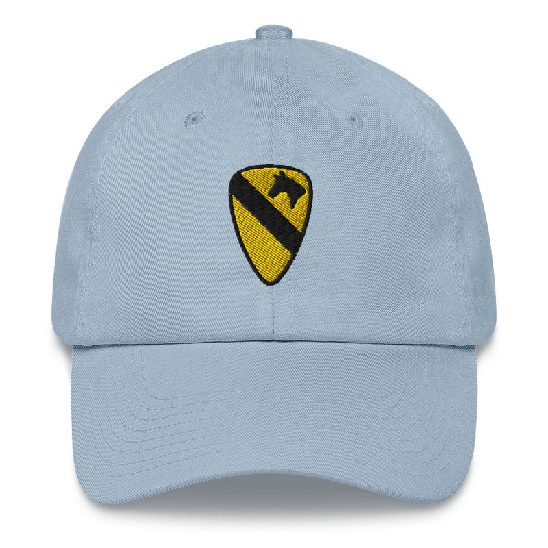 A light blue 1st Cavalry Division Hat with the logo on the front.  The hat has a curved visor and an adjustable strap at the back.