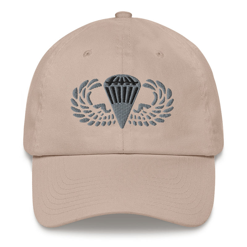 A stone colored Basic Parachutist Hat with the logo on the front.  The hat has a curved visor and an adjustable strap at the back.