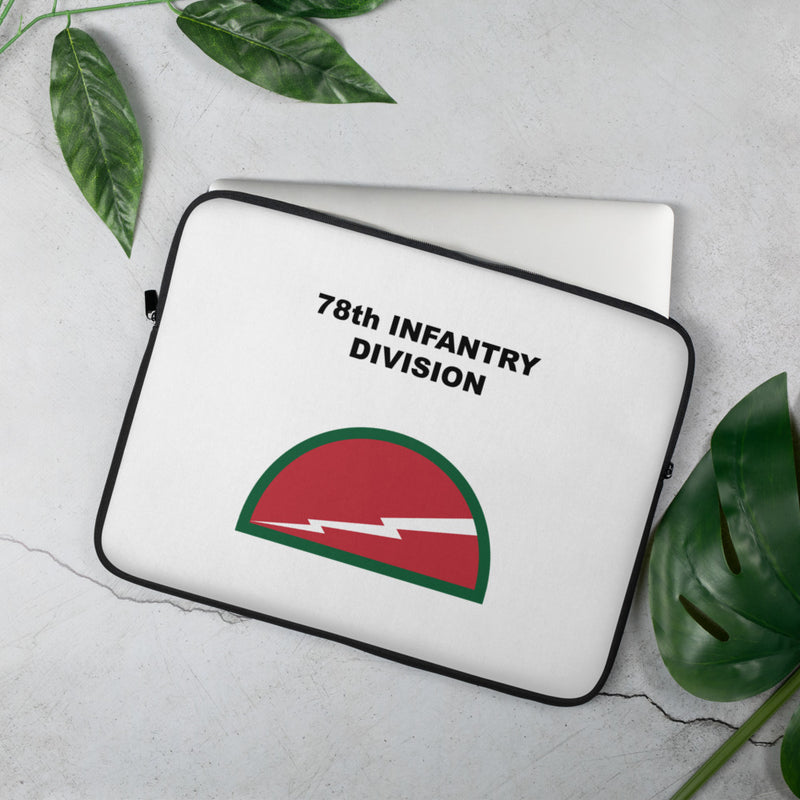 A lightweight and water-resistant white Laptop Sleeve with the 78th Infantry Division logo printed on top. The laptop sleeve is designed to fit a 15" laptop.
