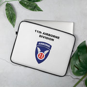 A lightweight and water-resistant white Laptop Sleeve with the 11th Airborne Division logo printed on top. The laptop sleeve is designed to fit a 15" laptop.