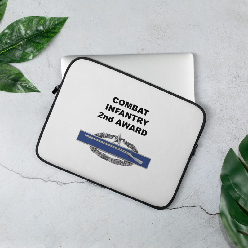 A lightweight and water-resistant white Laptop Sleeve with the Combat Infantry 2nd Award logo printed on top. The laptop sleeve is designed to fit a 13" laptop.