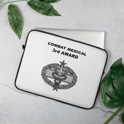 A lightweight and water-resistant white Laptop Sleeve with the Combat Medical 3rd Award logo printed on top. The laptop sleeve is designed to fit a 15" laptop.