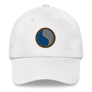 A white 29th Infantry Division Hat with the logo on the front.  The hat has a curved visor and an adjustable strap at the back.