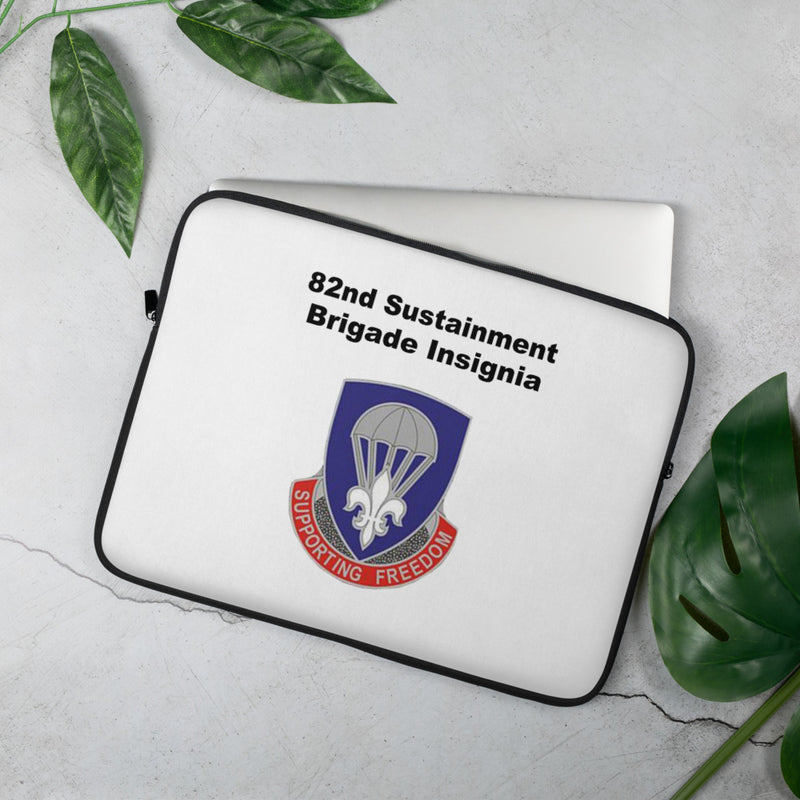 A lightweight and water-resistant white Laptop Sleeve with the 82nd Sustainment Brigade Insignia logo printed on top. The laptop sleeve is designed to fit a 15" laptop.